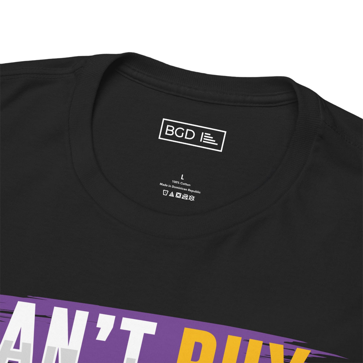 Close-up of black shirt neck tag featuring Can't Buy Motivation label detail
